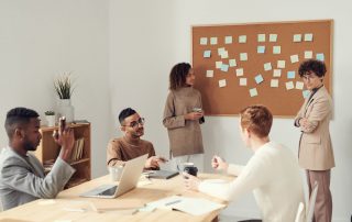 A group of people in a meeting brainstorming ideas.