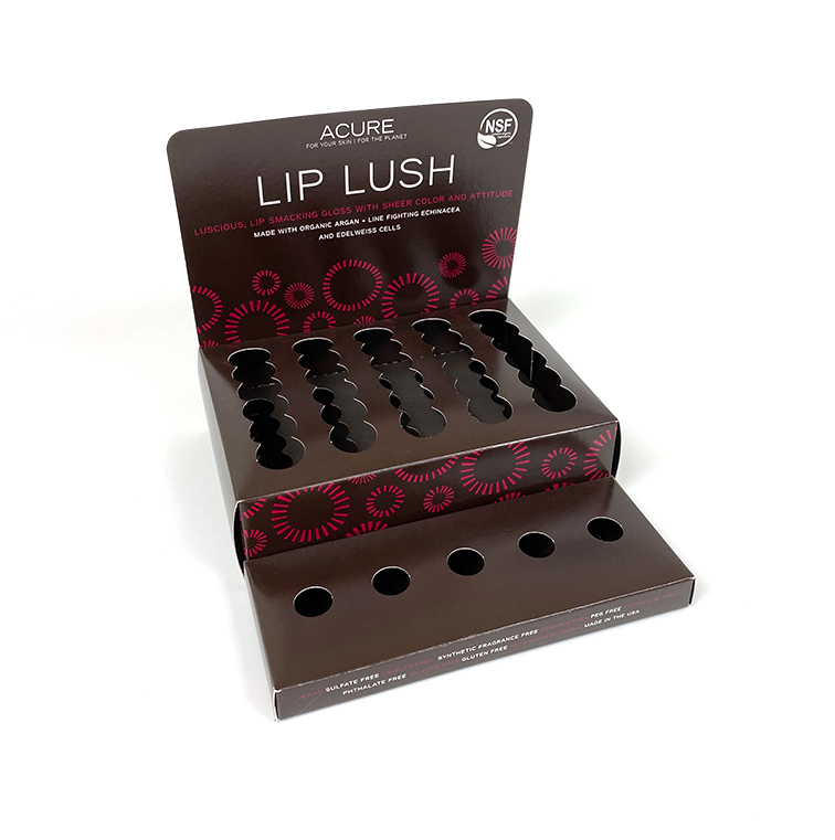 A display box that holds lip product for a skincare brand.